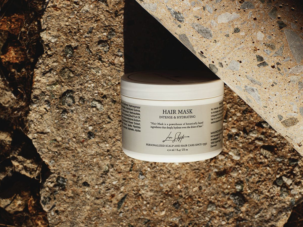 Harklinikken’s Hydrating Hair Mask within Nature resting on a rocky surface